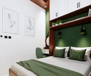 Kamar double bed dengan nuansa warna olive disertai meja rias di samping ranjang dan lukisan di dinding.